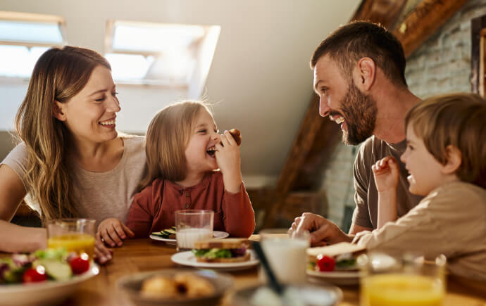 Young family eating at a dining table